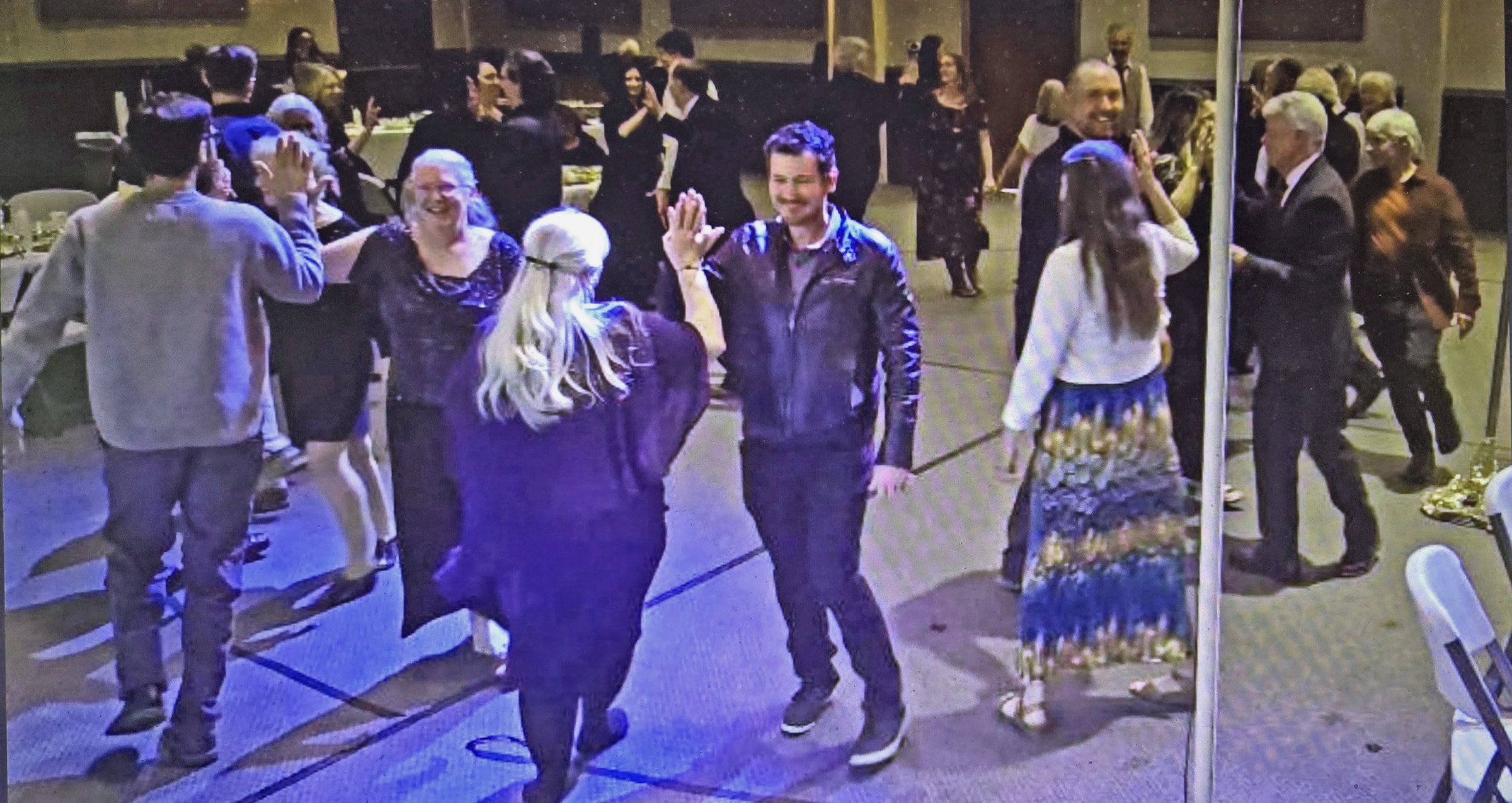 Couples dancing at a church fundraiser barn dance in Grants Pass, Oregon