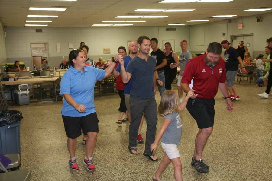 Group dancing Fjaskern (Hurry Scurry) at a community dance event
