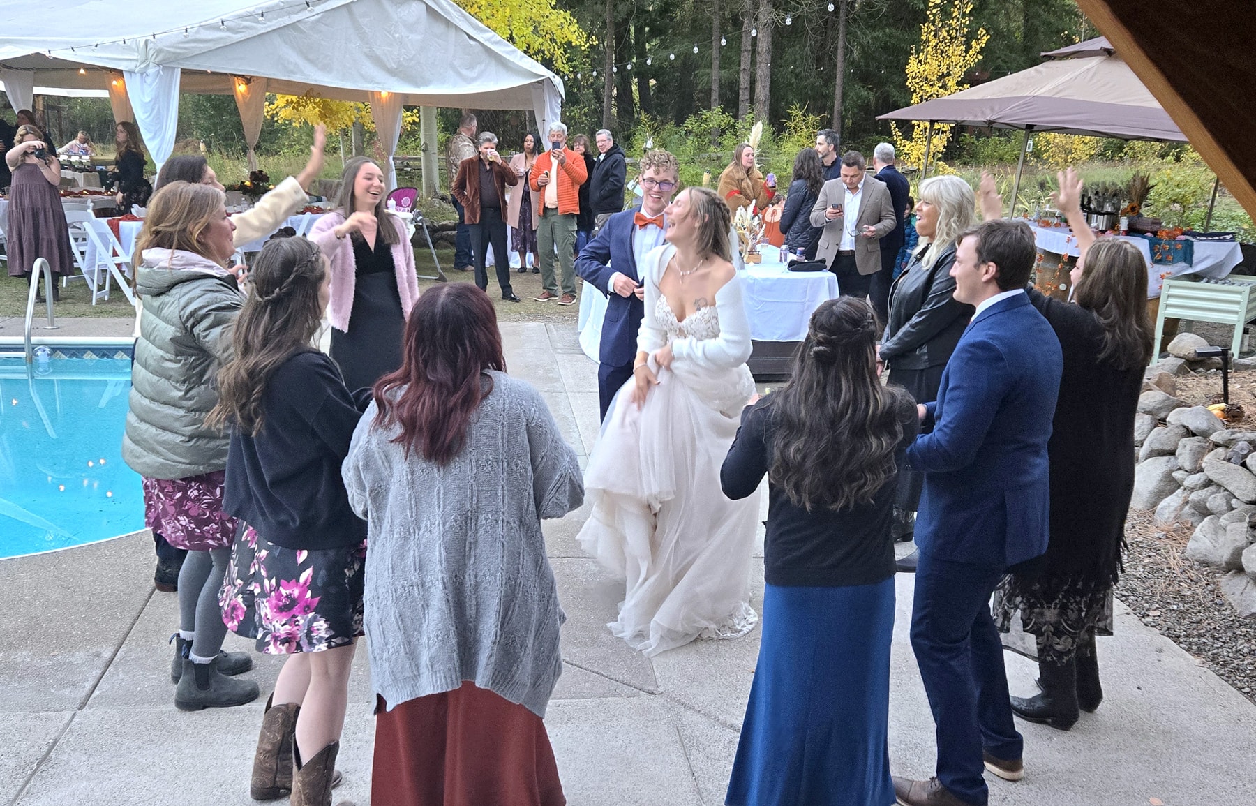 Bridal couple dancing at outdoor reception