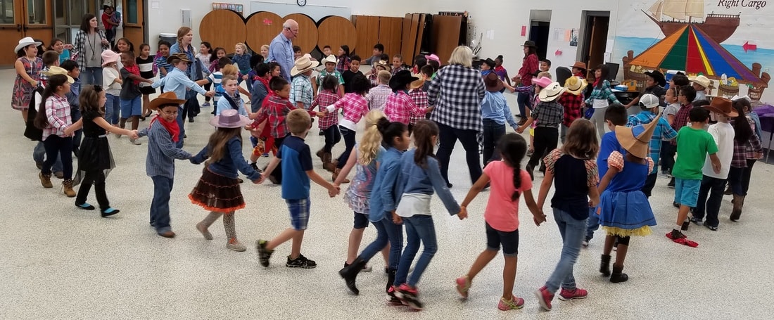 Children participating in a folk dance program at school