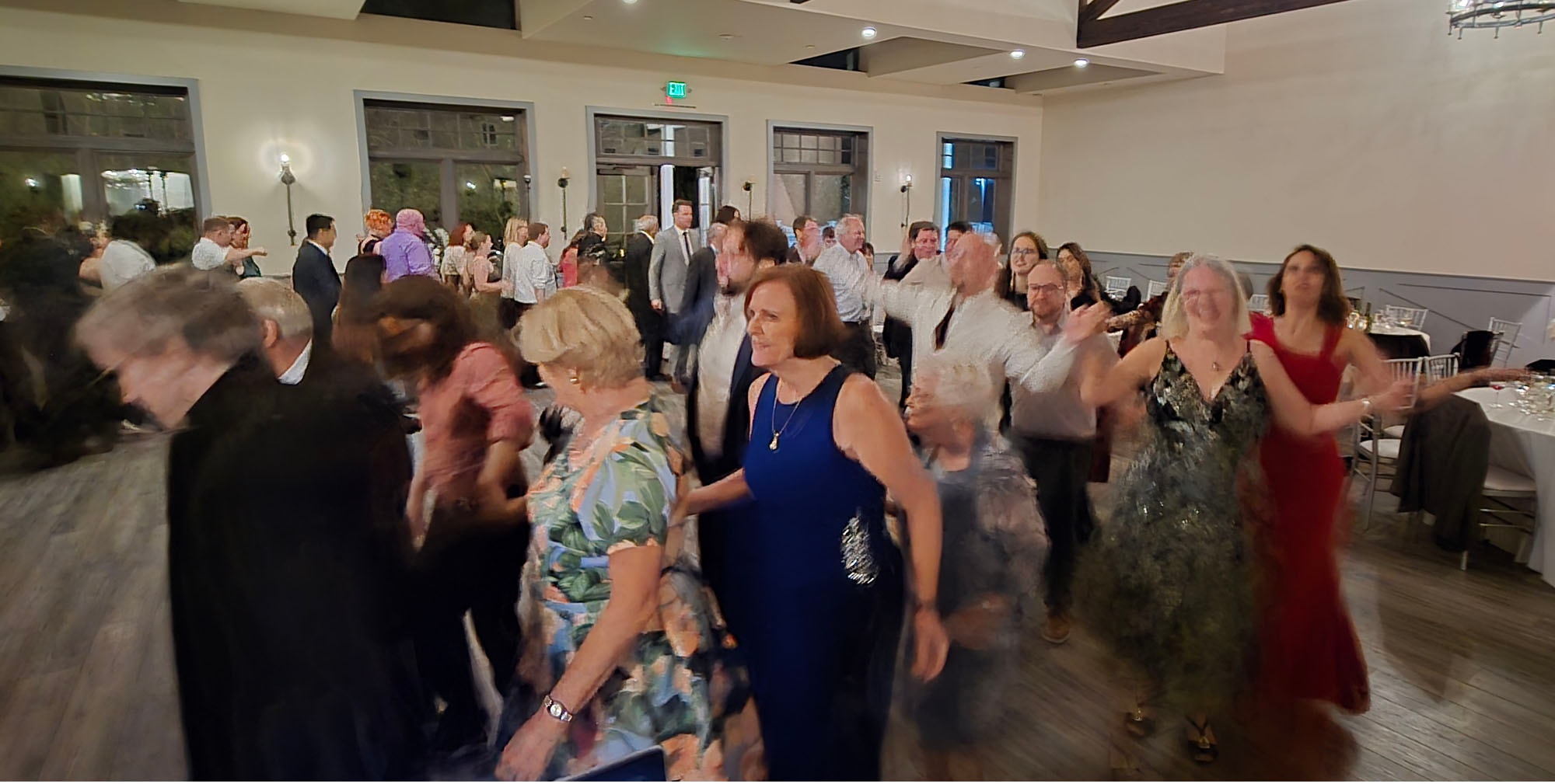 Crowd dancing at a barn dance celebration